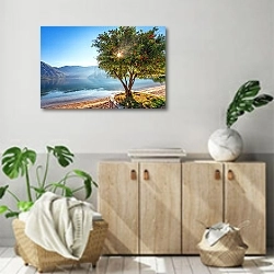 «Черногория. Утро на пляже» в интерьере современной комнаты над комодом