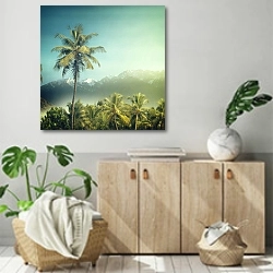 «Пальмы на фоне гор» в интерьере современной комнаты над комодом