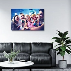 «Guys and girls singing at party» в интерьере офиса в зоне отдыха над диваном