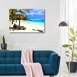 «Безмятежные пляжи острова Маврикий» в интерьере современной гостиной над синим диваном