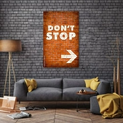 «Dont stop» в интерьере в стиле лофт над диваном