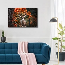 «Загадка осеннего леса» в интерьере современной гостиной над синим диваном