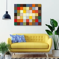 «Абстракция из разноцветных квадратов» в интерьере современной гостиной с желтым диваном