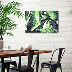 «Свежие зеленые тропические листья» в интерьере столовой в скандинавском стиле с кирпичной стеной