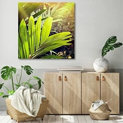 «Тропическая листва» в интерьере современной комнаты над комодом