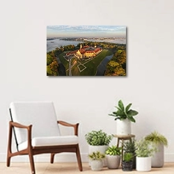 «Беларусь. Несвижский замок с птичьего полета» в интерьере современной комнаты над креслом