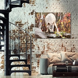 «Белый волк на фоне осеннего леса» в интерьере двухярусной гостиной в стиле лофт с кирпичной стеной