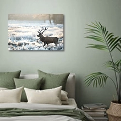 «Олень на фоне заходящего солнца» в интерьере современной спальни в зеленых тонах