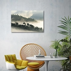 «Лес на высоком холме в тумане» в интерьере современной гостиной с желтым креслом