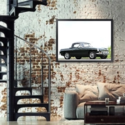 «MGB Roadster '1962–67» в интерьере двухярусной гостиной в стиле лофт с кирпичной стеной