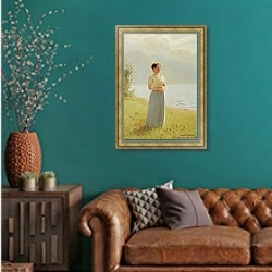 «Девушка на берегу Фьорда» в интерьере гостиной с зеленой стеной над диваном