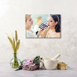 «Визажист делает профессиональный макияж молодой женщине» в интерьере салона красоты