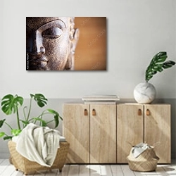 «Голова будды 2» в интерьере современной комнаты над комодом