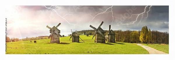 Постер Ветряные мельницы в поле, солнце и гроза с типом исполнения На холсте в раме в багетной раме 221-03