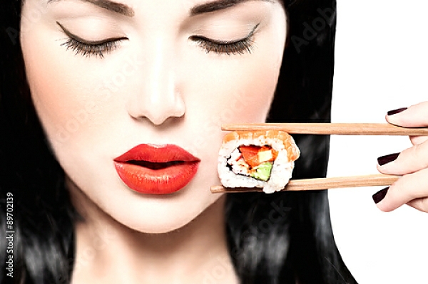Постер Девушка ест нигири суши палочками для еды с типом исполнения На холсте без рамы