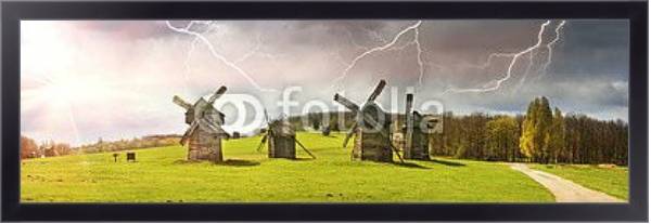 Постер Ветряные мельницы в поле, солнце и гроза с типом исполнения На холсте в раме в багетной раме 221-01