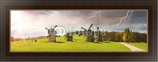 Постер Ветряные мельницы в поле, солнце и гроза с типом исполнения На холсте в раме в багетной раме 1.023.151