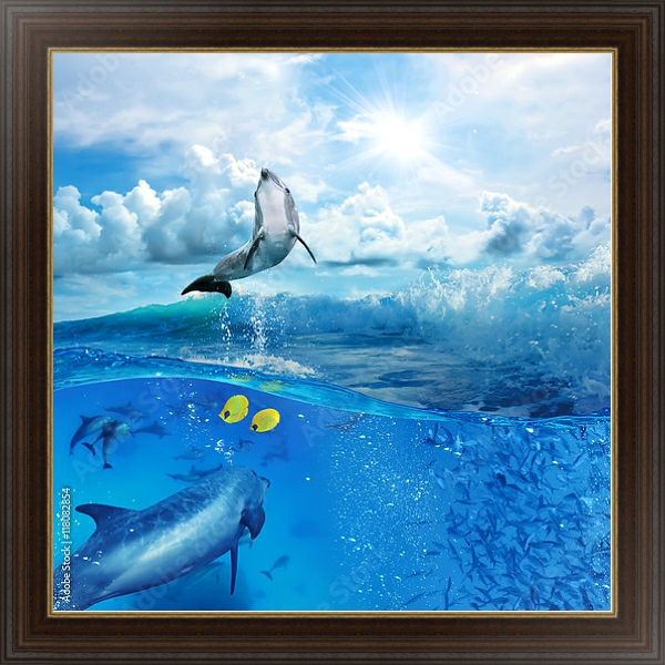 Постер Стая игривых дельфинов, плавающих под водой с типом исполнения На холсте в раме в багетной раме 1.023.151