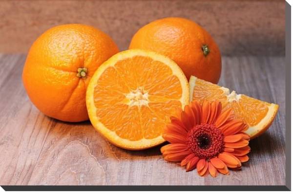 Постер Апельсины и оранжевая маргаритка с типом исполнения На холсте без рамы