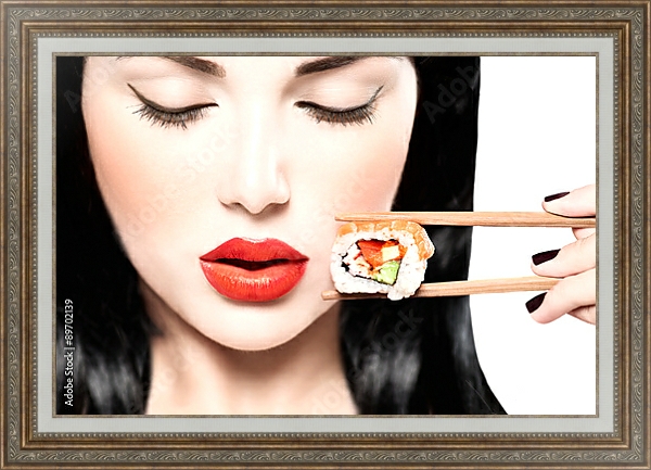 Постер Девушка ест нигири суши палочками для еды с типом исполнения На холсте в раме в багетной раме 595.M52.330